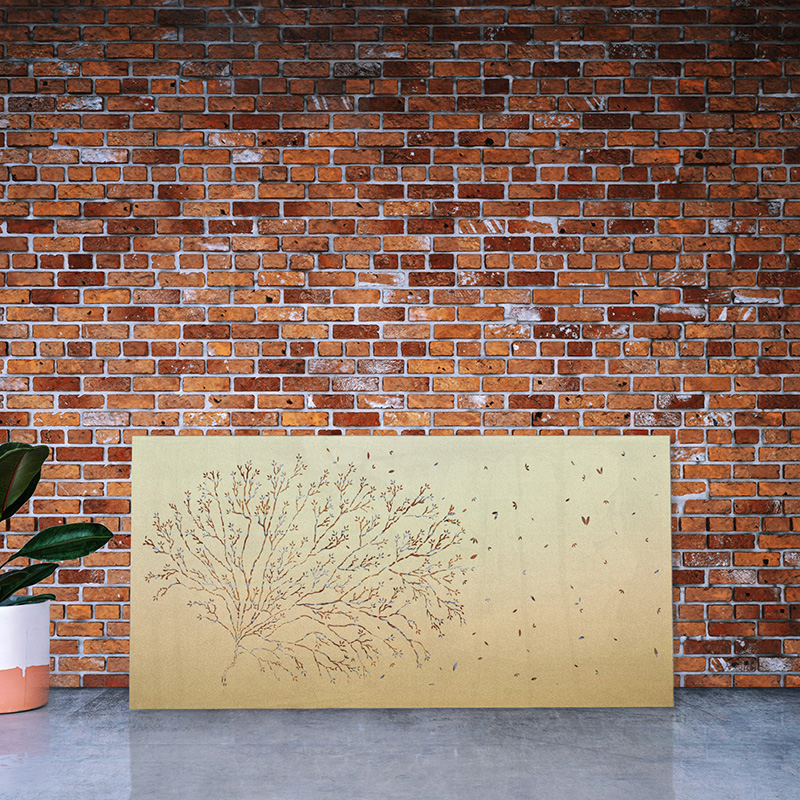 Decorative Privacy screen made from laser cut brass leaning on factory wall