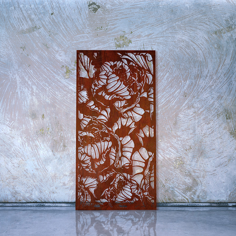 Rusted Corten Steel Laser Cut Decorative Screen leaning on whitewashed wall