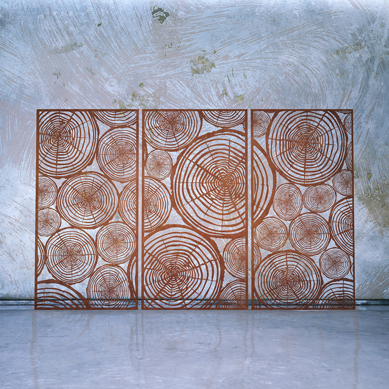 Rusted Corten Steel Laser Cut Decorative Screen leaning on whitewashed wall