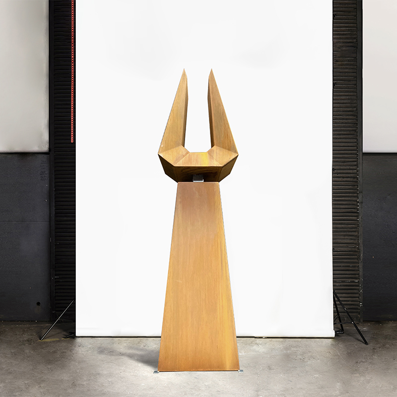 Tall slender masculine sculpture inspired by the Bull designed and created by Lump Sculpture Studio; Tall sculpture made from corten steel with natural rusted finish