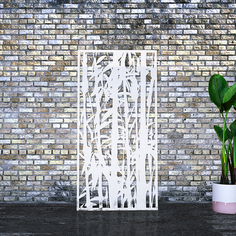 White decorative screen laser cut garden screen leaning against brick wall