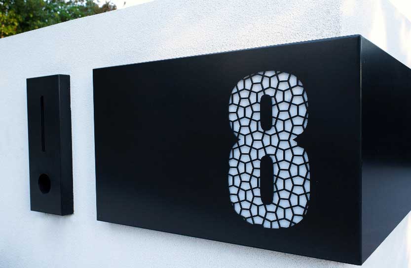 Custom made black steel letterbox with laser cut number 8