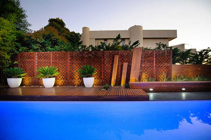 Laser cut Decorative screens by Lump Studio used as pool fence