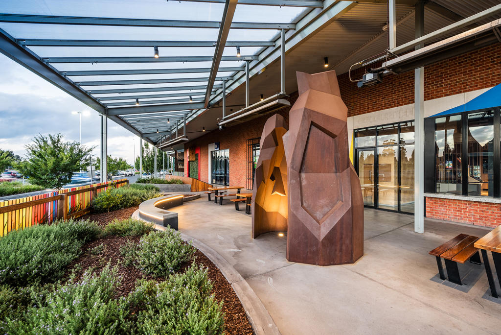 Large outdoor sculpture made from rusted Corten Steel