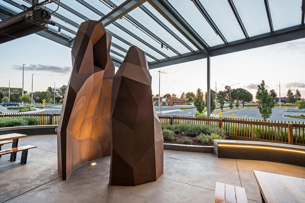 Large outdoor sculpture made from rusted Corten Steel