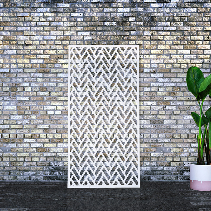 White Decorative Screen with laser cut screen design leaning on factory wall