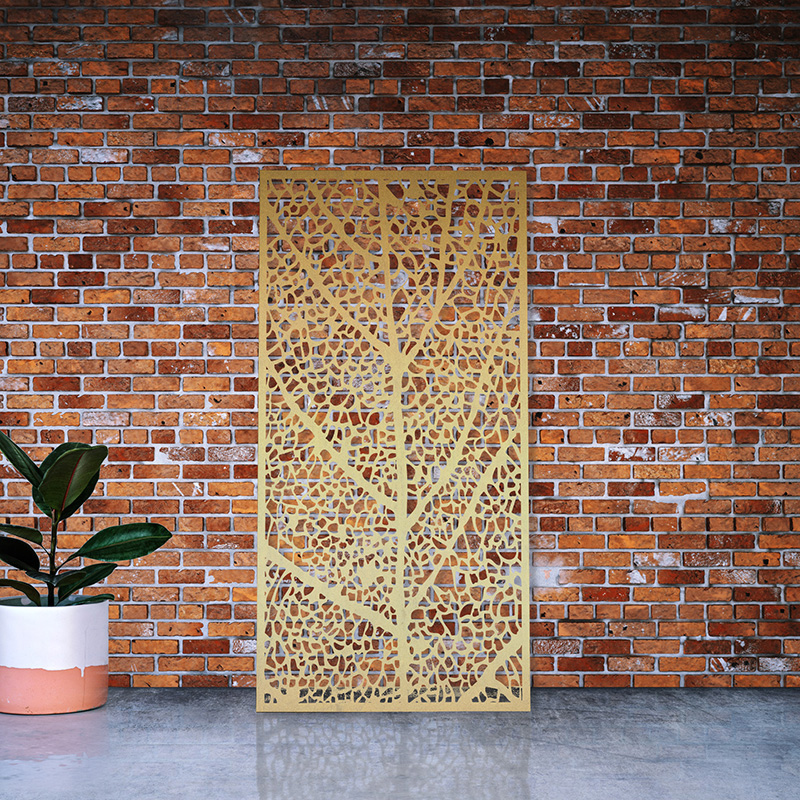 Brass Decorative Laser Cut Screen leaning on red brick wall