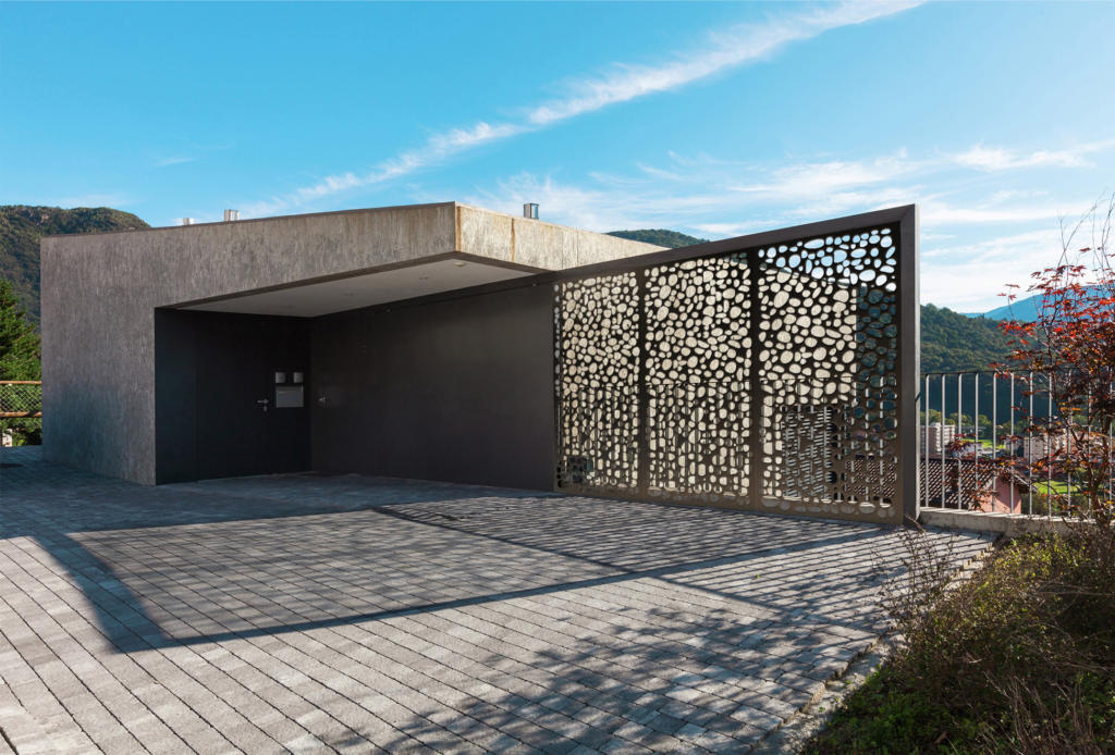 Bronze Laser cut Screen used as privacy screen at entrance to modern home