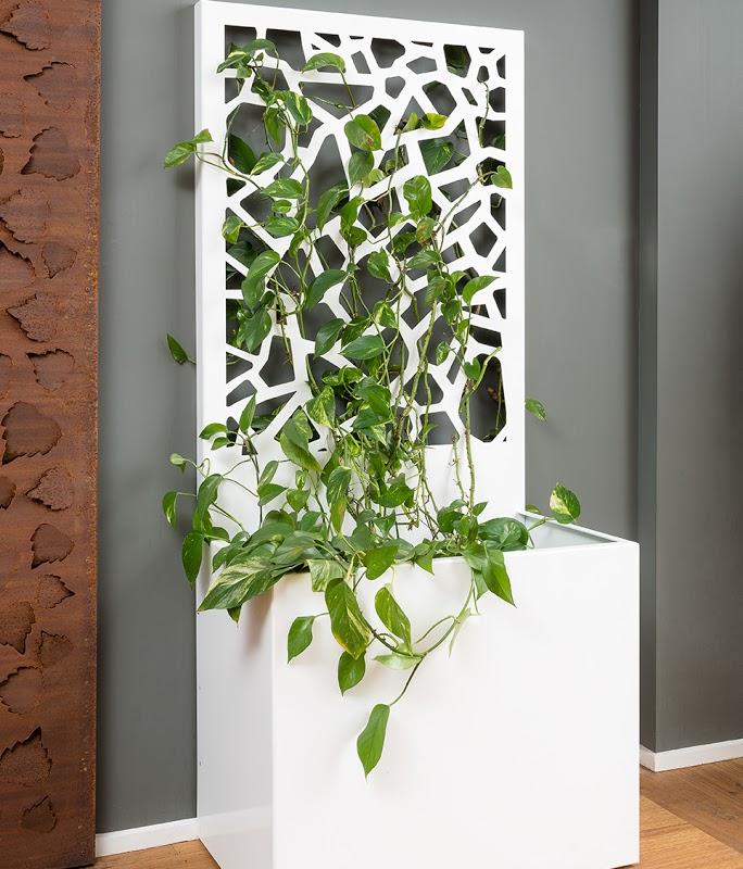 A freestanding screen offering privacy and a generous planter for your greenery