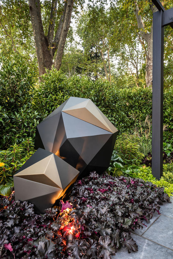 Lump Sculpture Studio Facted Orb Sculpture displayed in landscape designed by Inge Jabara for MIFGS 2019