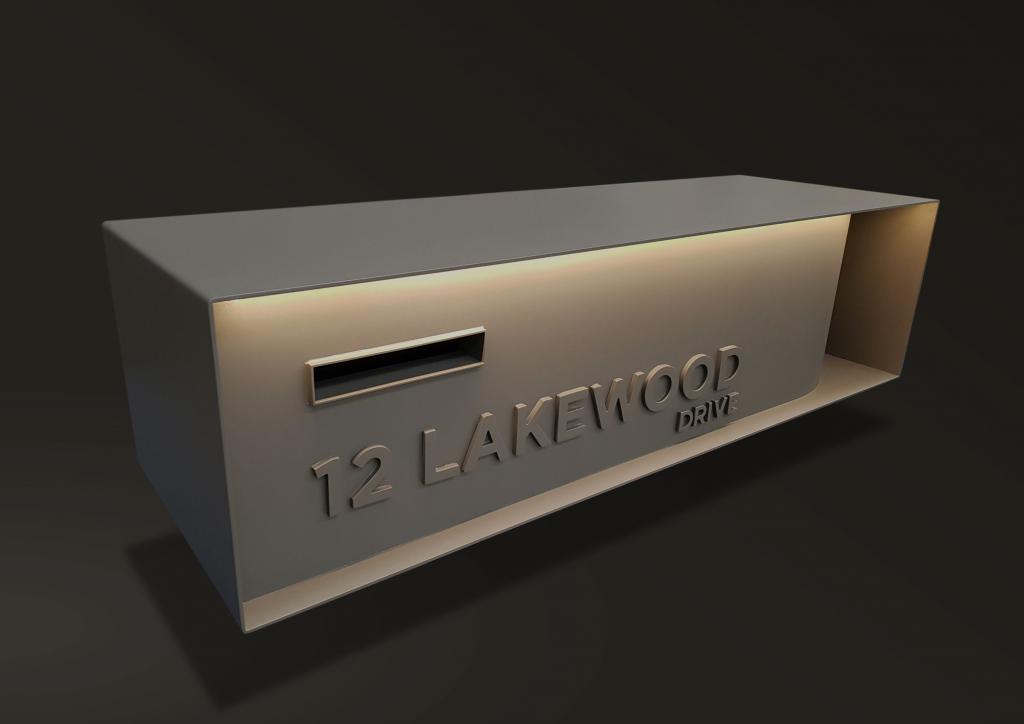 Custom made letterbox with lighting made from Corten steel with laser cut address and detail