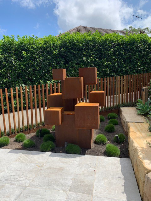 A custom sculpture made from cubes of varying sizes in Corten Steel by Lump Studio