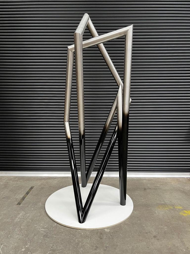 Modern sculpture with Black detail made from Stainless steel by Lump Studio