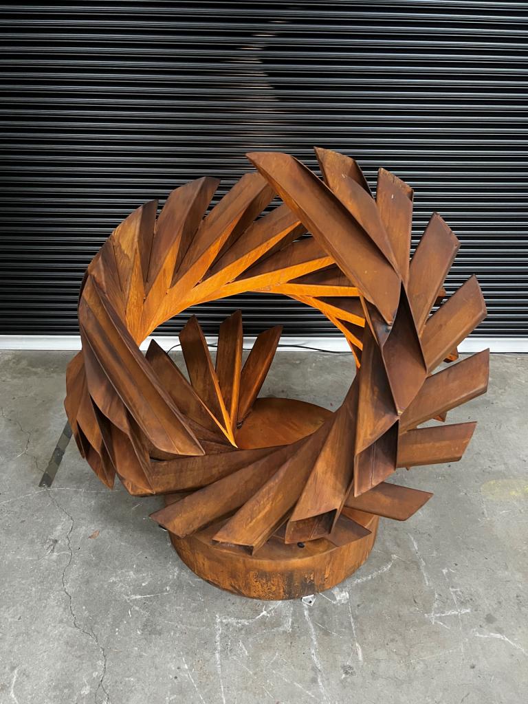 Sculpture depicting a Nest shape made from Rusted Steel by Lump Studio