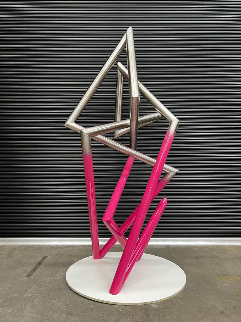 Modern sculpture with Pink detail made form Stainless steel by Lump Studio