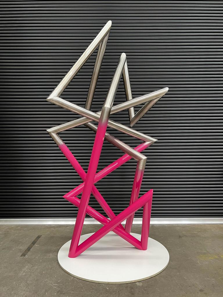 Modern sculpture with Pink detail made from Stainless steel by Lump Studio