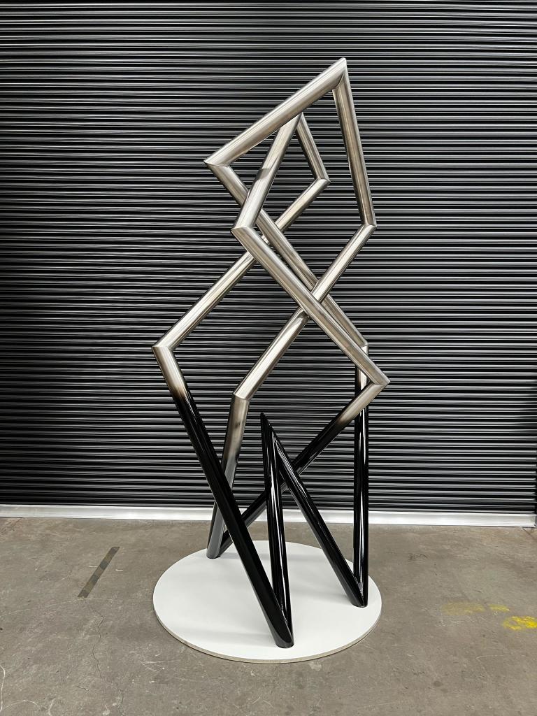 Modern sculpture with Black detail made from Stainless steel by Lump Studio
