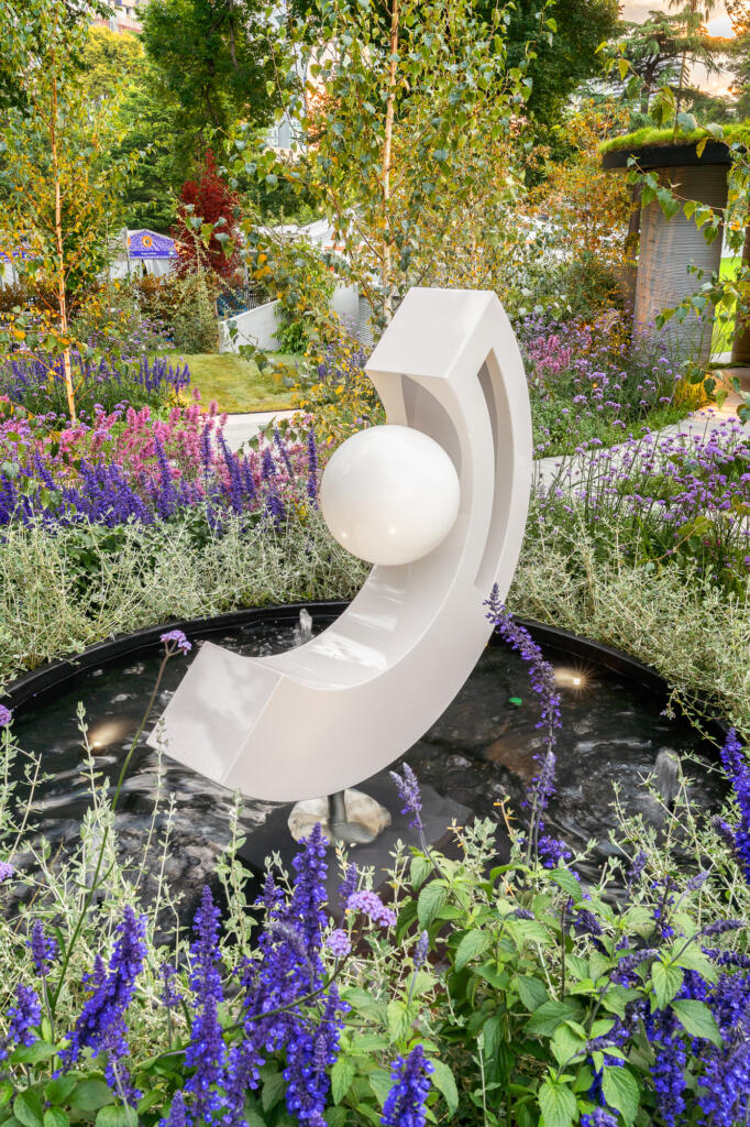 Show Garden by Inge Jabara at Melbourne International Flower and Garden Show featuring work by Lump Sculpture Studio