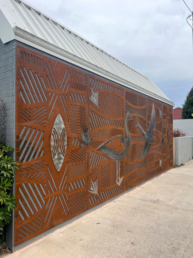 Public mural made from Corten Steel and Stainless Steel designed by Dixon Patten a Yorta Yorta, Gunnai, Gunditjmara, Wemba Wemba, Djab Wurrung man, the lead artist and designer of Bayila Creative. Fabricated and installed at Parkdale Pree School by Lump Sculpture Studio