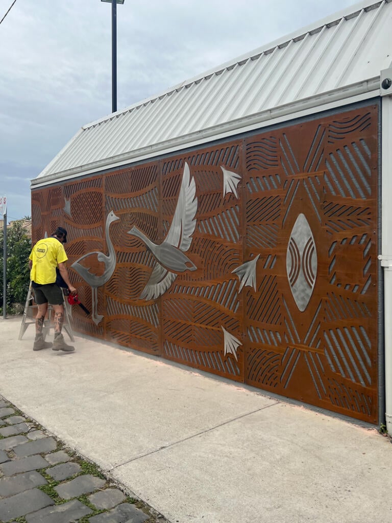 Public mural made from Corten Steel and Stainless Steel designed by Dixon Patten a Yorta Yorta, Gunnai, Gunditjmara, Wemba Wemba, Djab Wurrung man, the lead artist and designer of Bayila Creative. Fabricated and installed at Parkdale Pree School by Lump Sculpture Studio