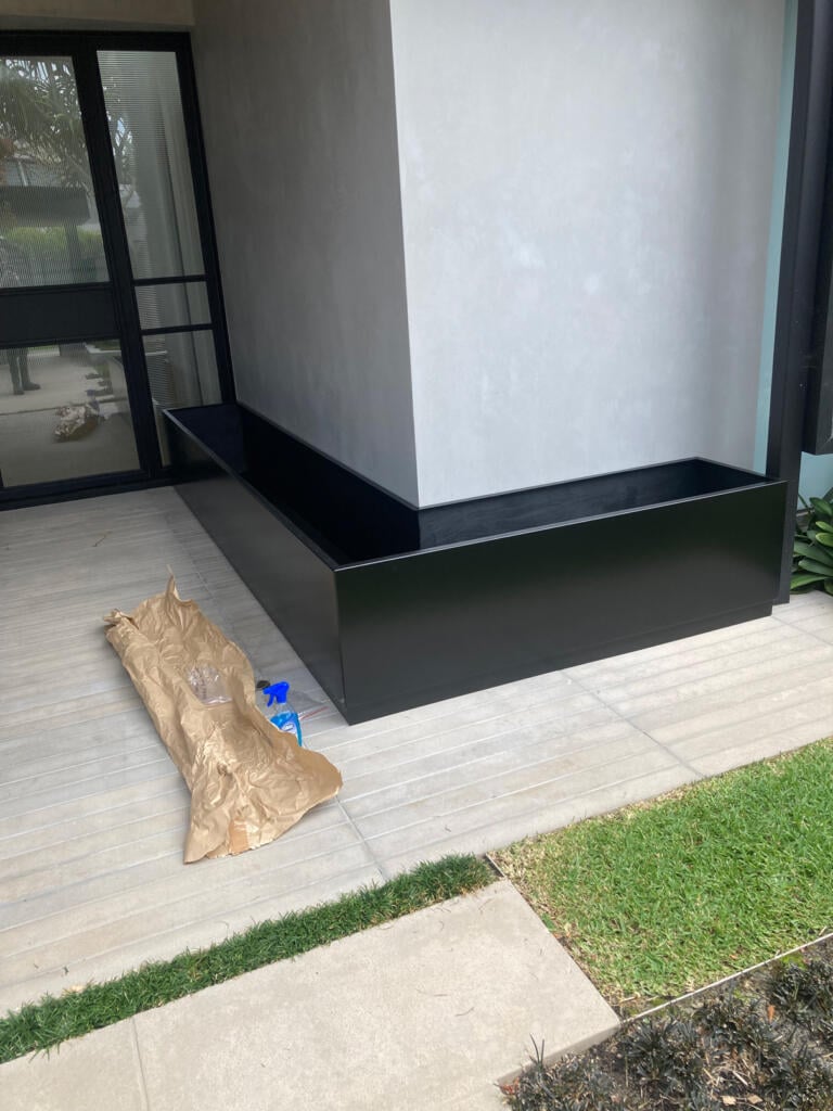Custom L-Shape metal planter by Lump Australia for residential and commercial landscaping